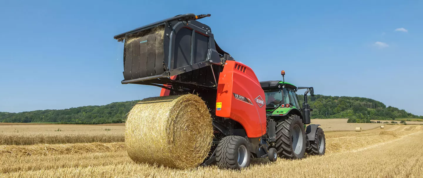 KUHN VB 3200 series round baler baling in the field