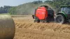 KUHN VB 3200 series round baler baling in the field